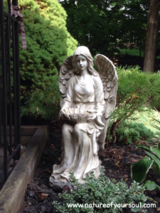 A serene angel statue in a garden